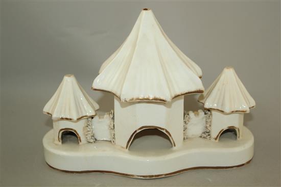 Three Staffordshire porcelain models of toll houses and another of a church, mid 19th century, height 11.5 - 18cm